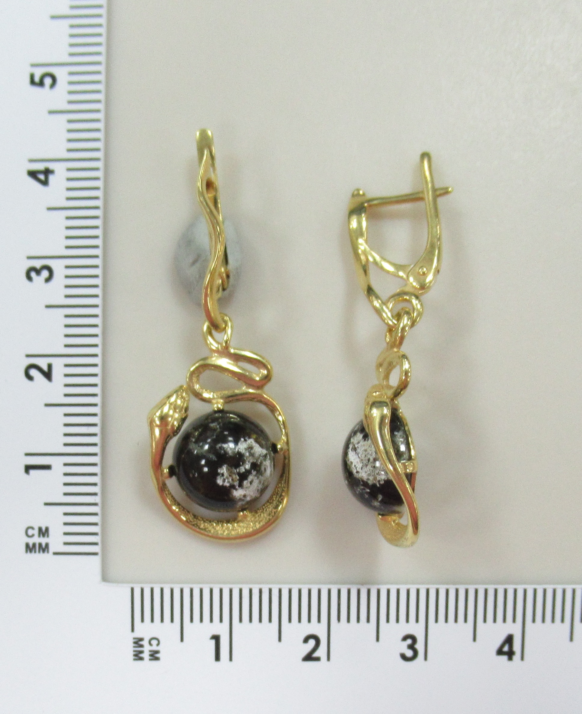 Серебряные серьги с янтарем "Змеи"